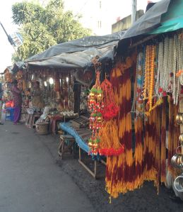 Tokens of devotion for sale along the road in Kalighat Temple in Calcutta.